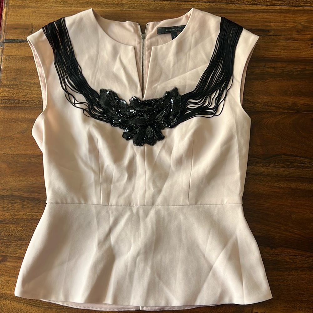 Light pink with black embroidery lace and fringes by BCBG. Elegant and like new.